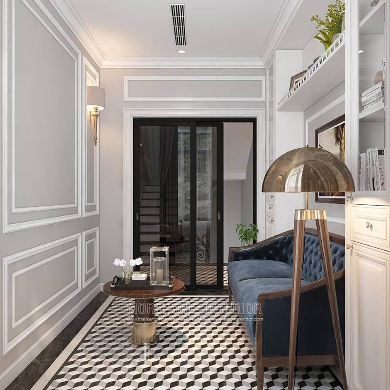 Gạch lát nền giả cổ, sofa băng gỗ óc chó tân cổ điển bọc nệm xanh cùng tường trắng đơn sắc đã tạo nên không gian đẹp sang trọng, đáp ứng tối đa công năng cho phòng đọc sách. Mẫu nội thất biệt thự tân cổ điển